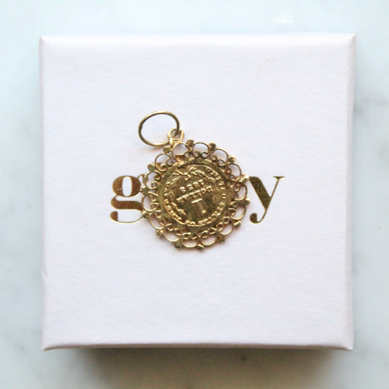 One Dollar Ornate Charm